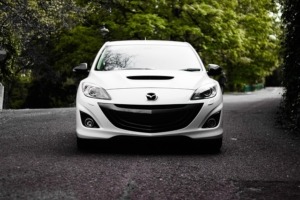 White Mazda Parked on Road - Mazda Performance Chips Improve Horsepower