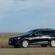 Black Subaru Outback driving on country road - Subaru Performance Chips by Chip Your Car Improve Horsepower