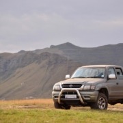 Green Toyota truck parked around hills - Chip Your Car Toyota Performance Chips Improve Horsepower