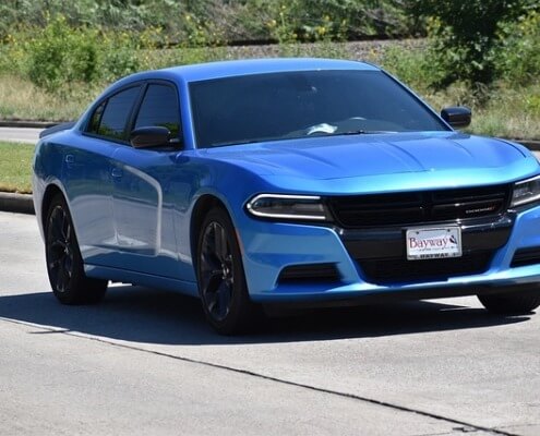 Blue dodge vehicle driving - Dodge Performance Chips Improve Gas Mileage