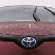 red toyota car in rain - Toyota Performance Chips Improve MPG