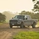 truck driving on dirt road - Chip Your Car Do Truck Performance Chips Work?